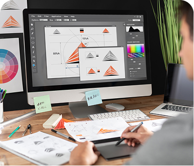 Graphic designer working on logo designs on a computer